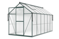 aranżacja ciemno zielonej szklarni "slide in" przed domem